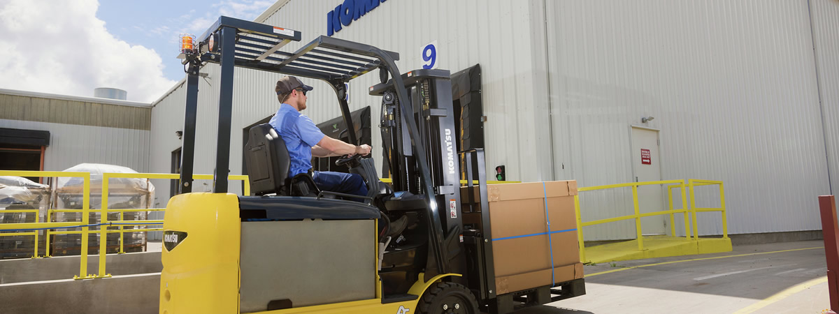 picture of forklift moving a box